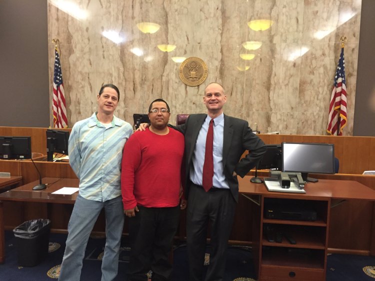 Brad and clients in court after a successful case.